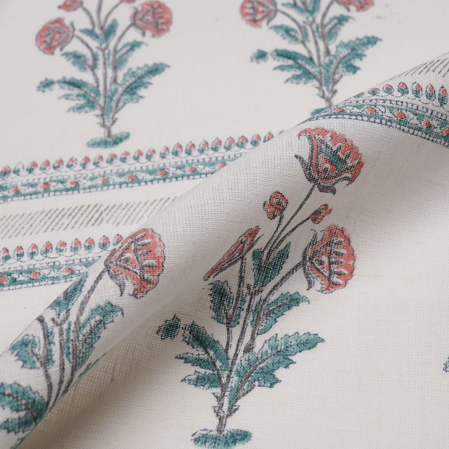 Explore the fusion of East and West with Persian-style rugs and Indian floral textiles.